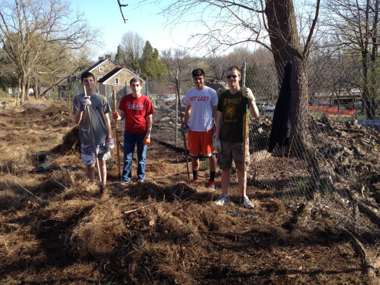 Justin Morgandale and friends work on his Eagle Scout reclamation project at the Heller Homestead barnyard in Lower Saucon Township.