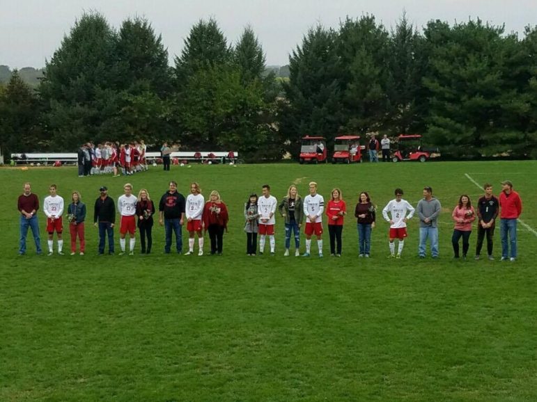 The eight senior members of the Saucon boys varsity soccer team were escorted onto their home field by their parents Saturday, which was Senior Day for the team.