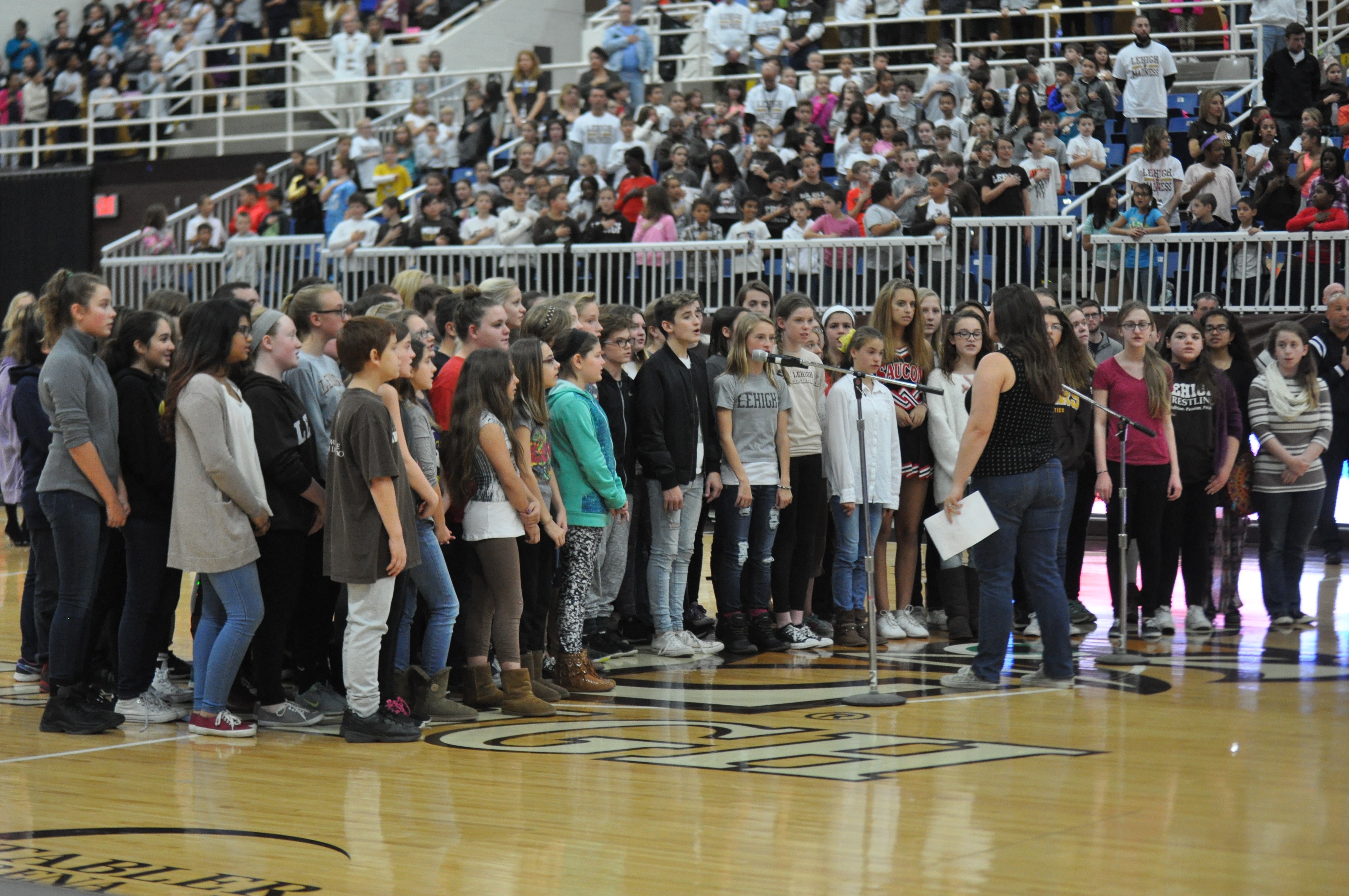 From center-court the SVMS chorus sang the national anthem.