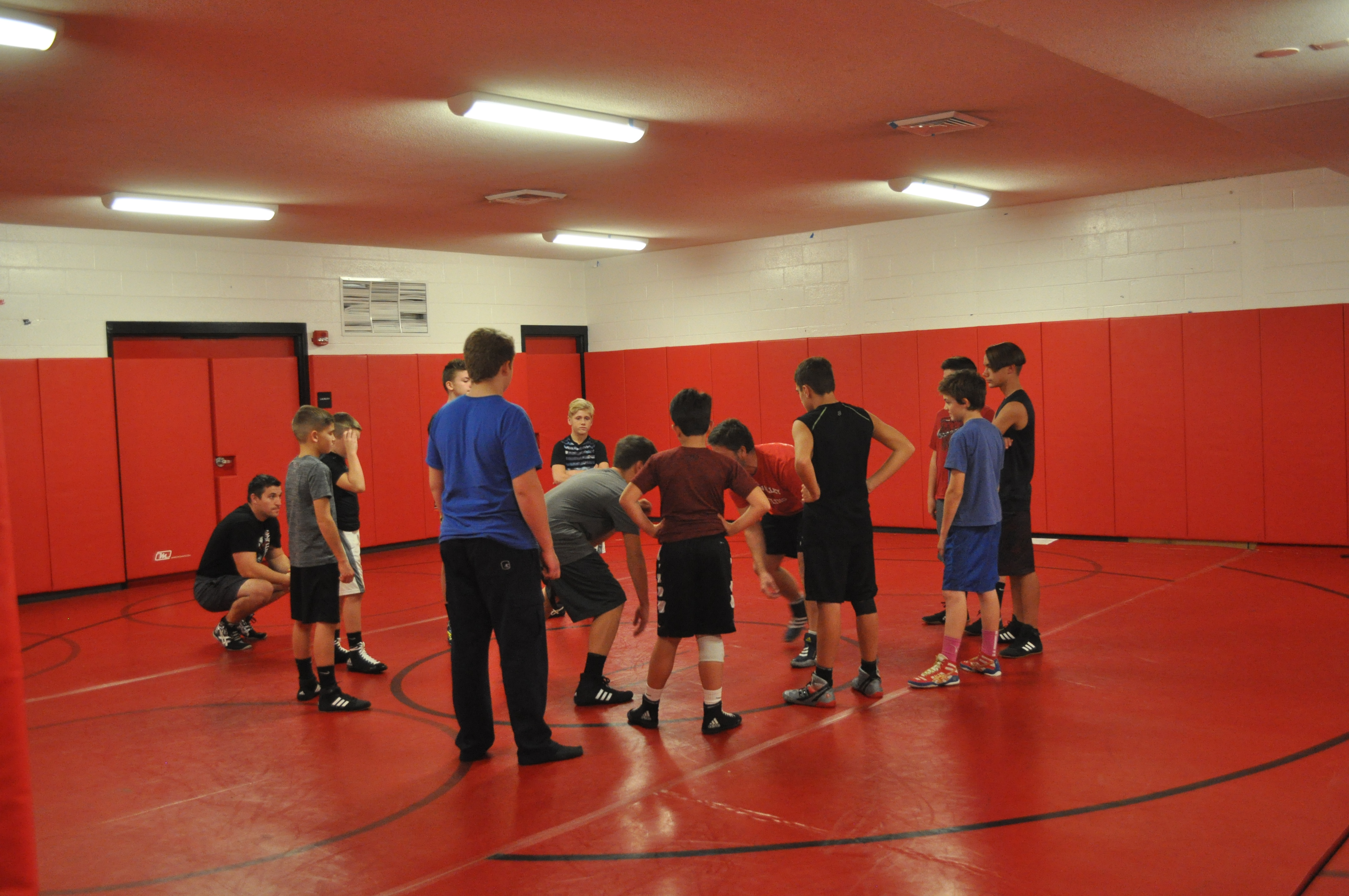 Junior High wrestling coach Any Koch showing the importance of a good stance.