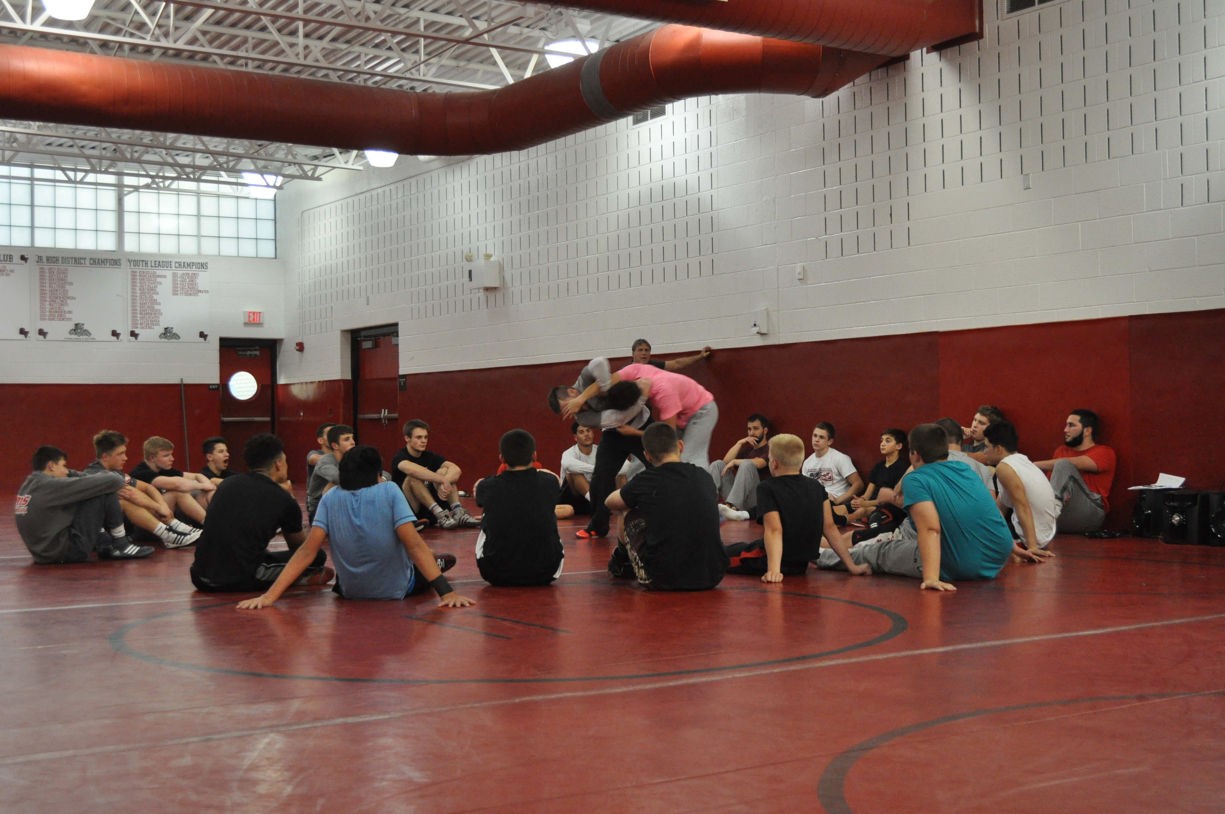 Saucon Valley wrestling coach Tommy Rohn demonstrates for the HS wrestlers.