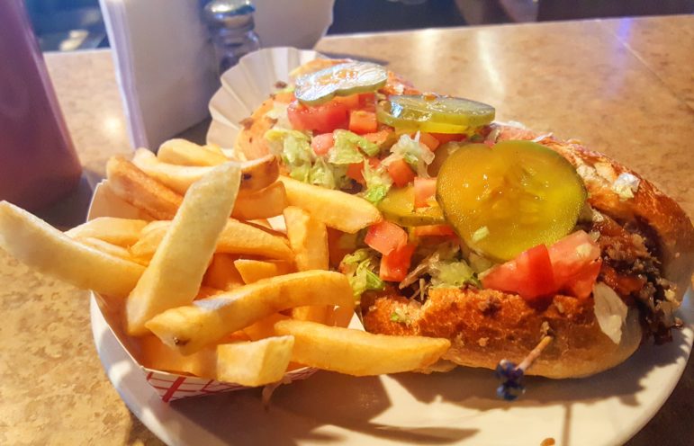 A California steak sandwich with fries, served at the Crossroads bar