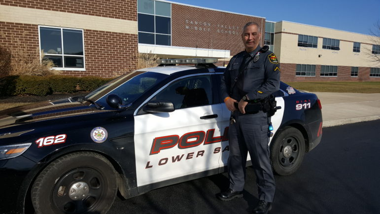 Lower Saucon Township Police Ofc. Chuck Werkheiser gets to play Santa during "Operation Santa Stop," which he conceived five years ago as a way to help brighten the holidays for stressed motorists and show them that police do care.