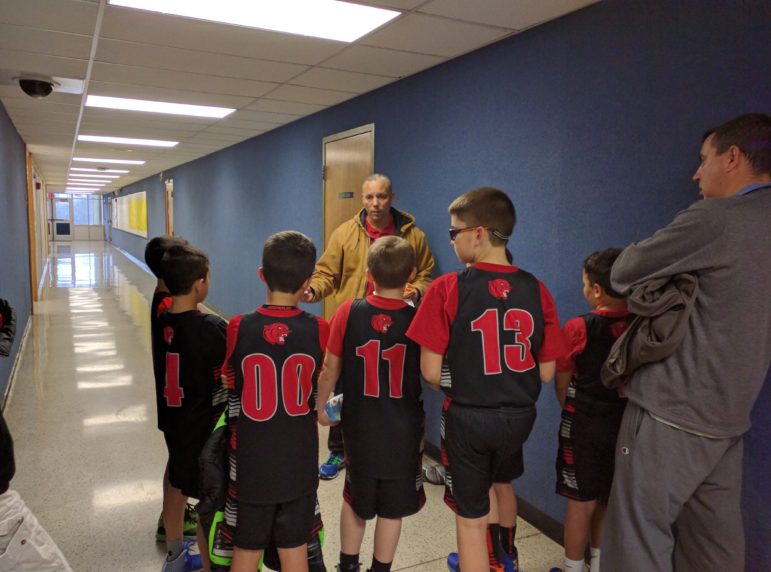 Coach Dan Miller gives the 3/4 Boys Travel team a pep talk prior to their win over Salisbury Sunday.