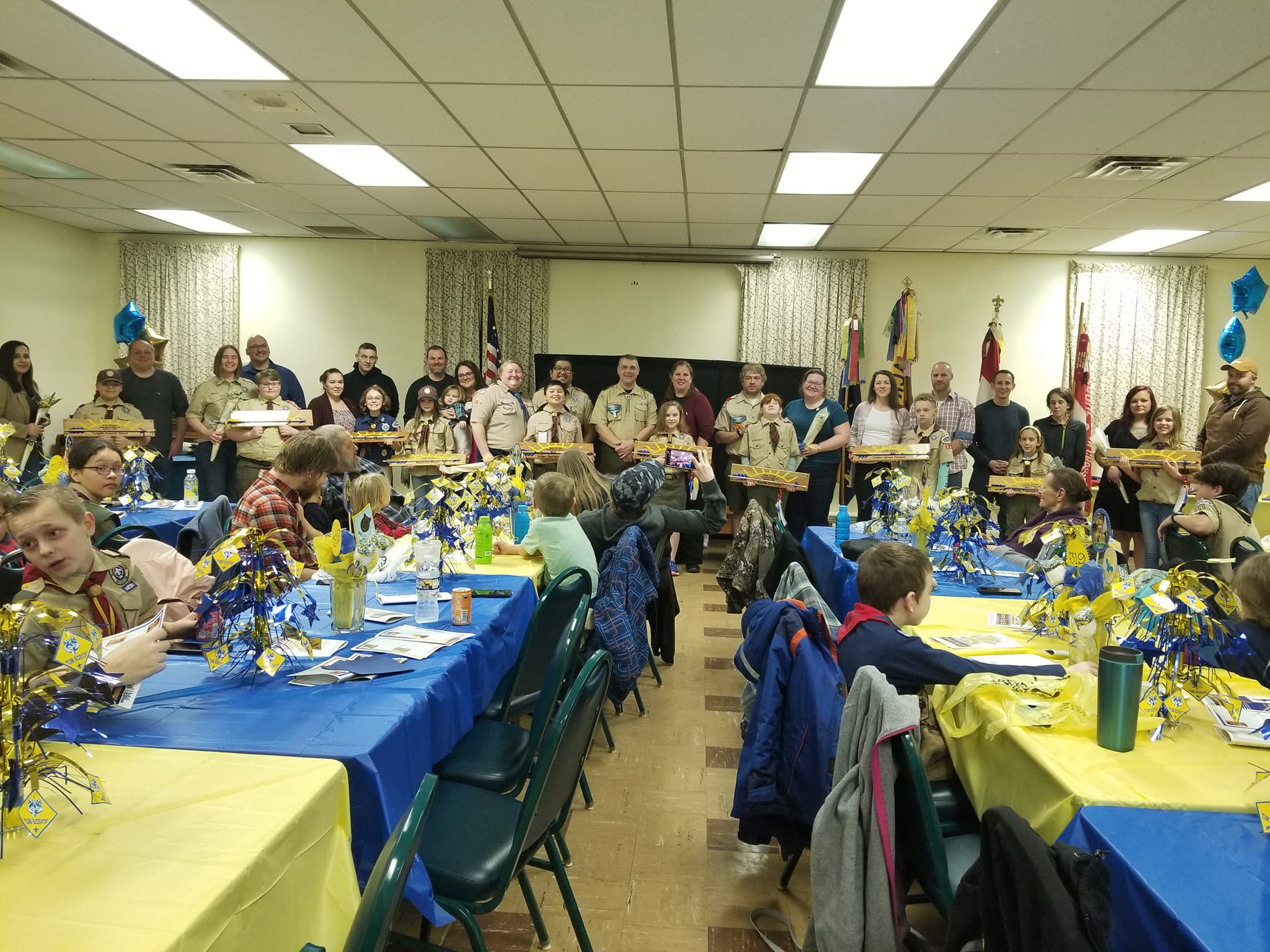 Blue and Gold Scouts with parents