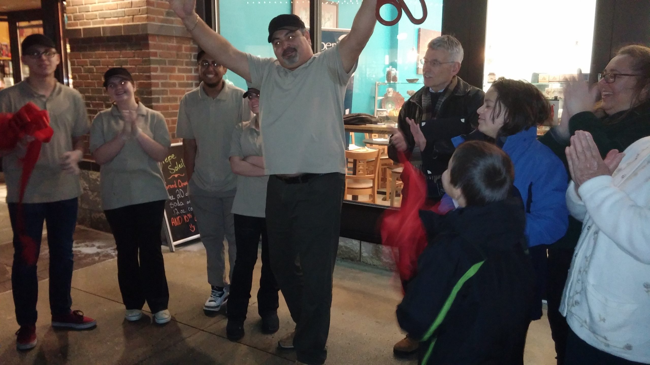 Seif Zaddem celebrates the ribbon being cut at his new creperie in Upper Saucon Township, Crepe Soleil.