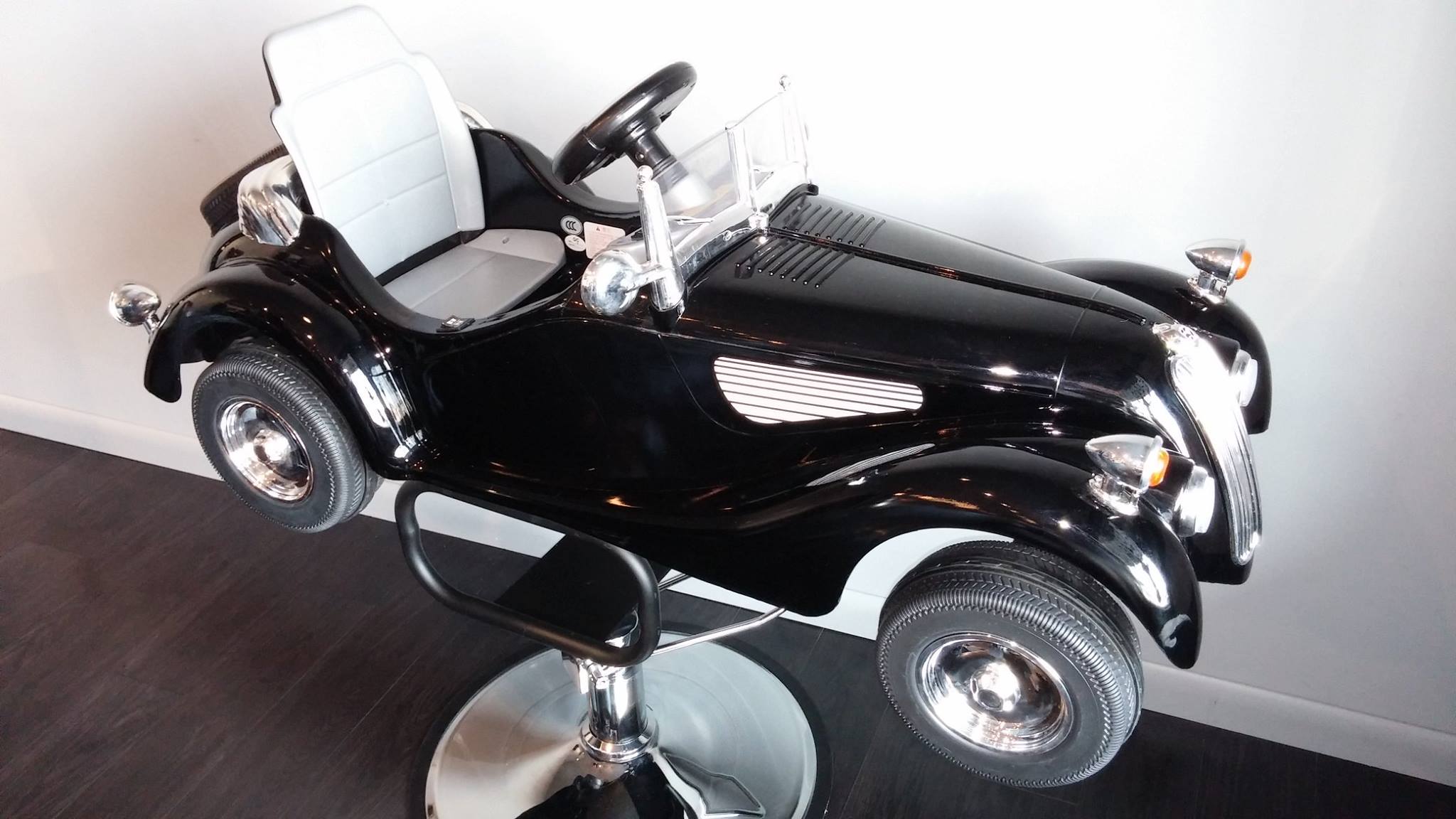 Hairs What's Happening is kid-friendly, with a pedal car-style seat for little ones who come in for a cut.