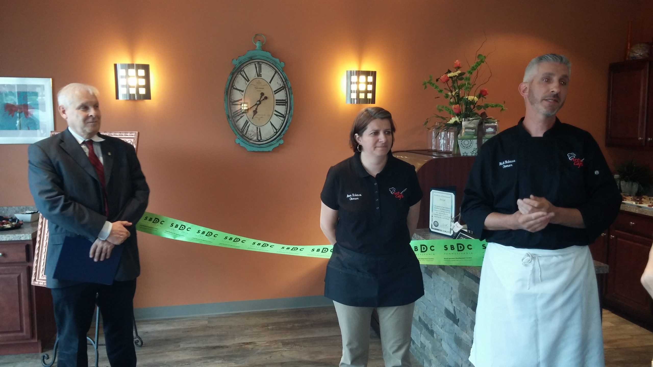 From left, Vincent O'Domski, district director for U.S. Rep. Charlie Dent; and Art Cafe owners Ann Takacs and Rick Takacs.