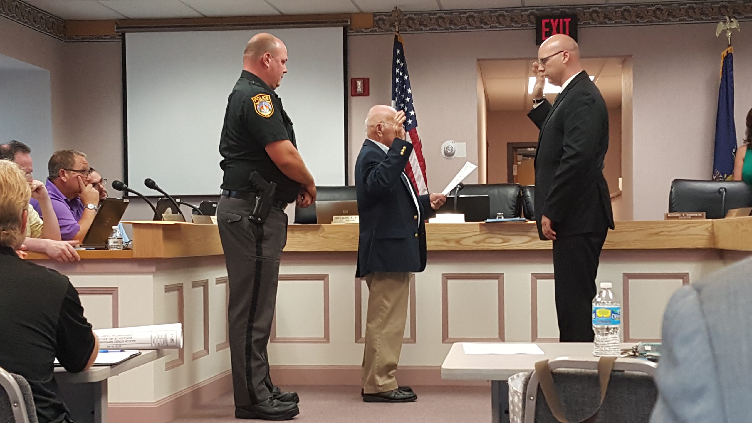 Jacob Fouts is administered an oath by Hellertown Mayor Richard Fluck upon his appointment as a part-time officer with the Hellertown Police Department. At left is Police Chief Robert Fluck.