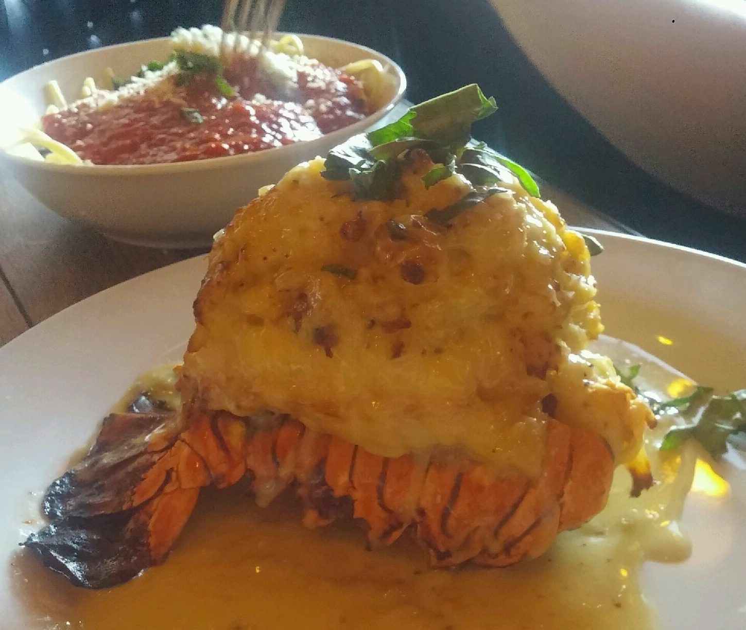 Lobster Tail with a side serving of linguine with marinara sauce