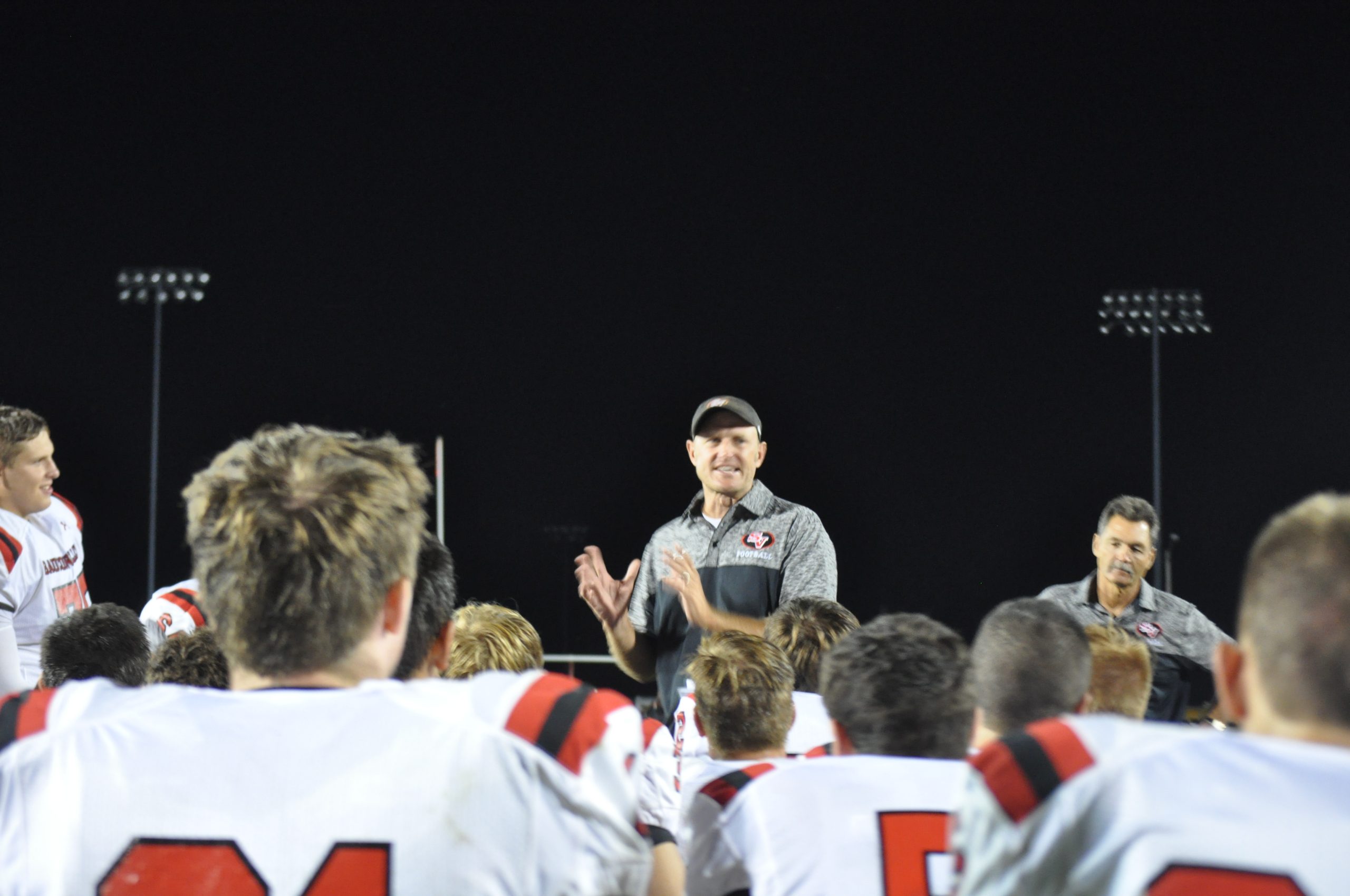 Saucon Valley's Phil Sams recognizes his troops for a job well-done following his first career win as head football coach at Saucon Valley