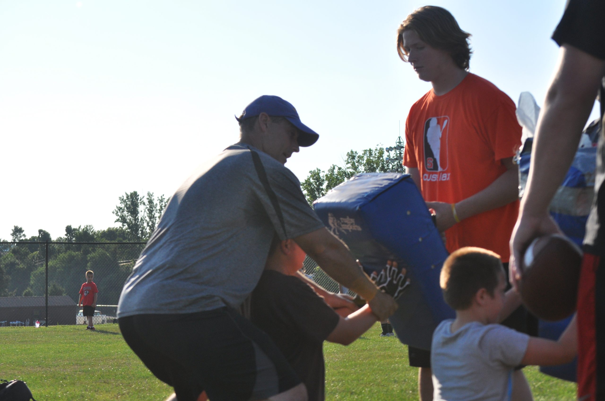 SV High School assistant coach Mike Philips helping future Hog John Wargo with his hand placement.