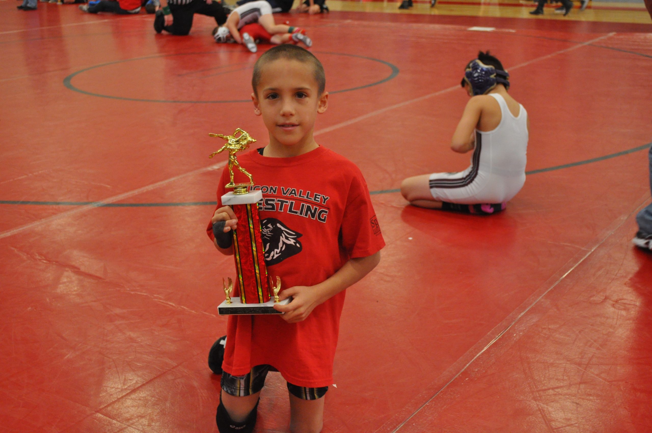 Carter Chunko posing with some Turkey Tourney hardware.