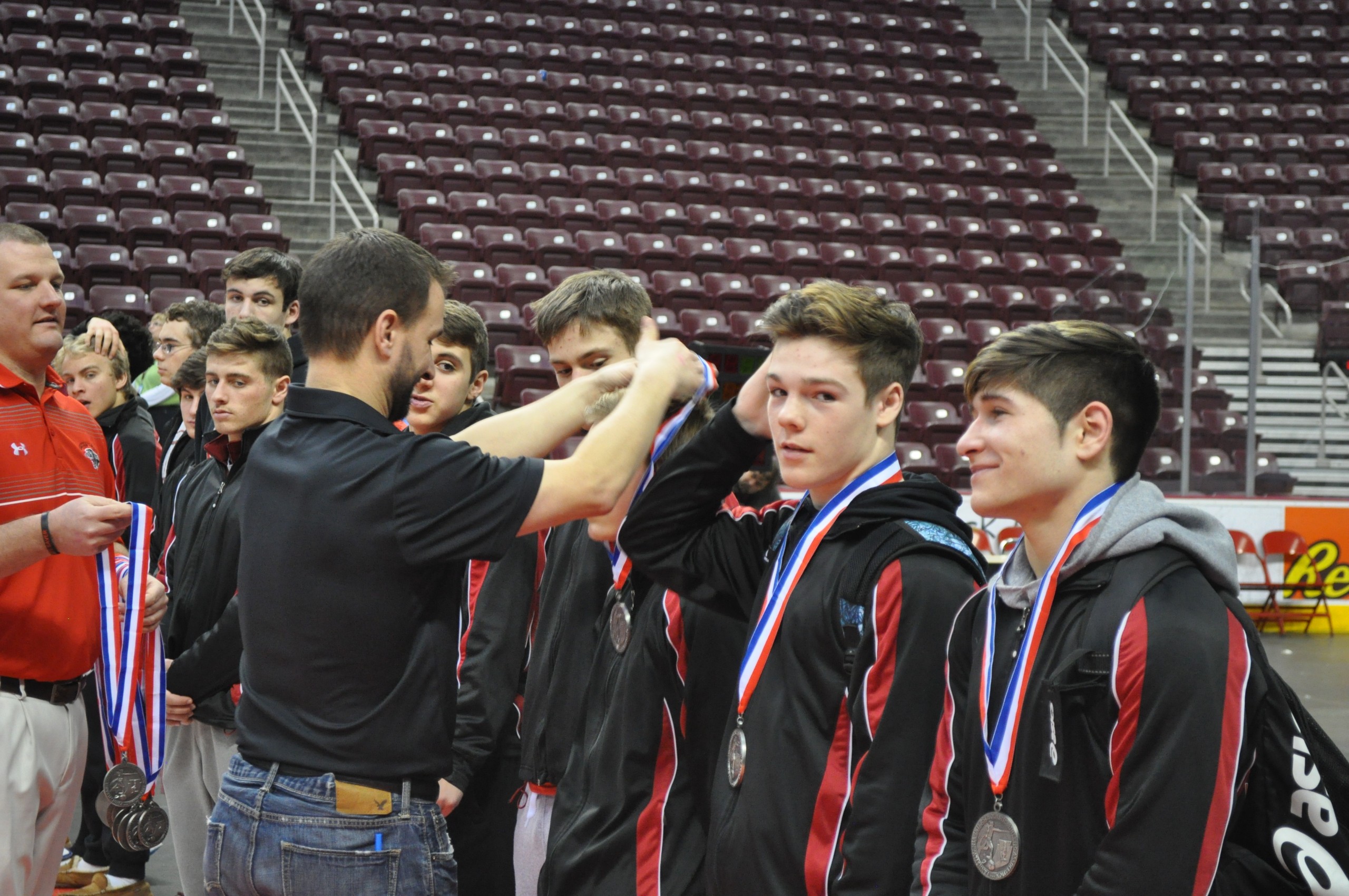 Coach Shirk with the honors of rewarding his wrestlers for a great team effort in the PIAA Championships