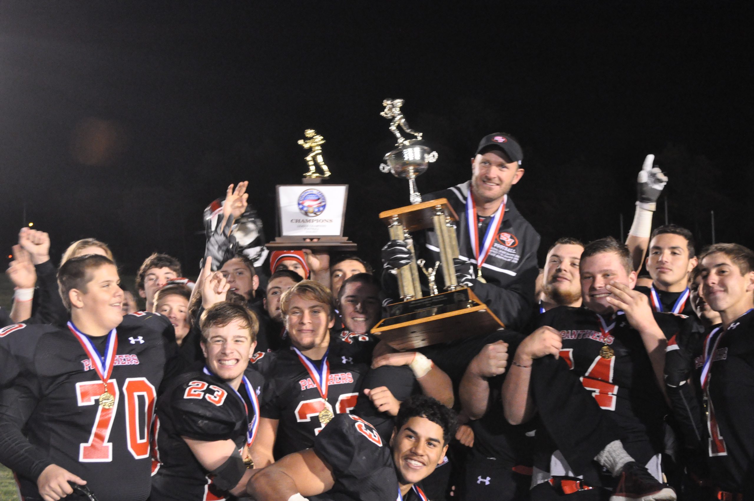 The Panthers give Coach Sams a championship ride.