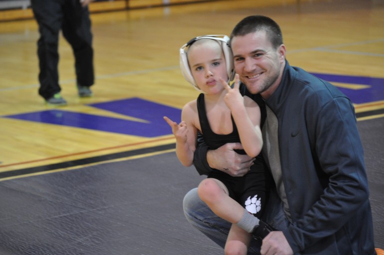 Tommy and Taylor Rohn celebrating Taylor's two pins