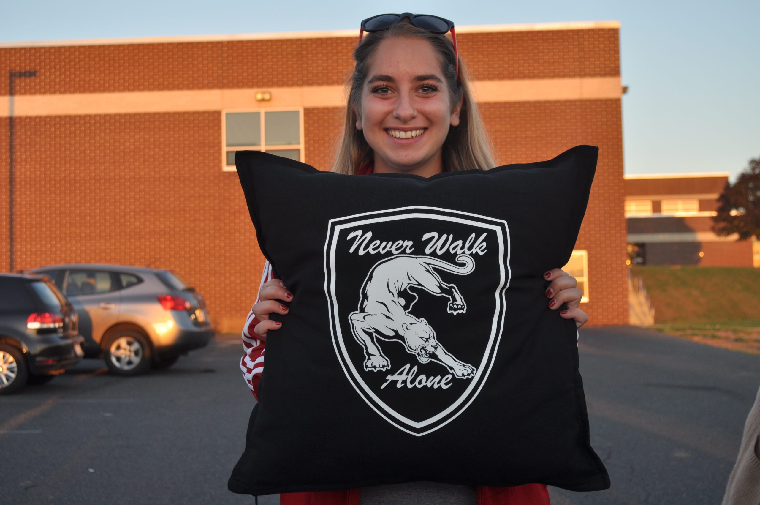 Saucon senior Katia Faroun shows off her senior gift with Ochse's trademark motto "Never Walk Alone"
