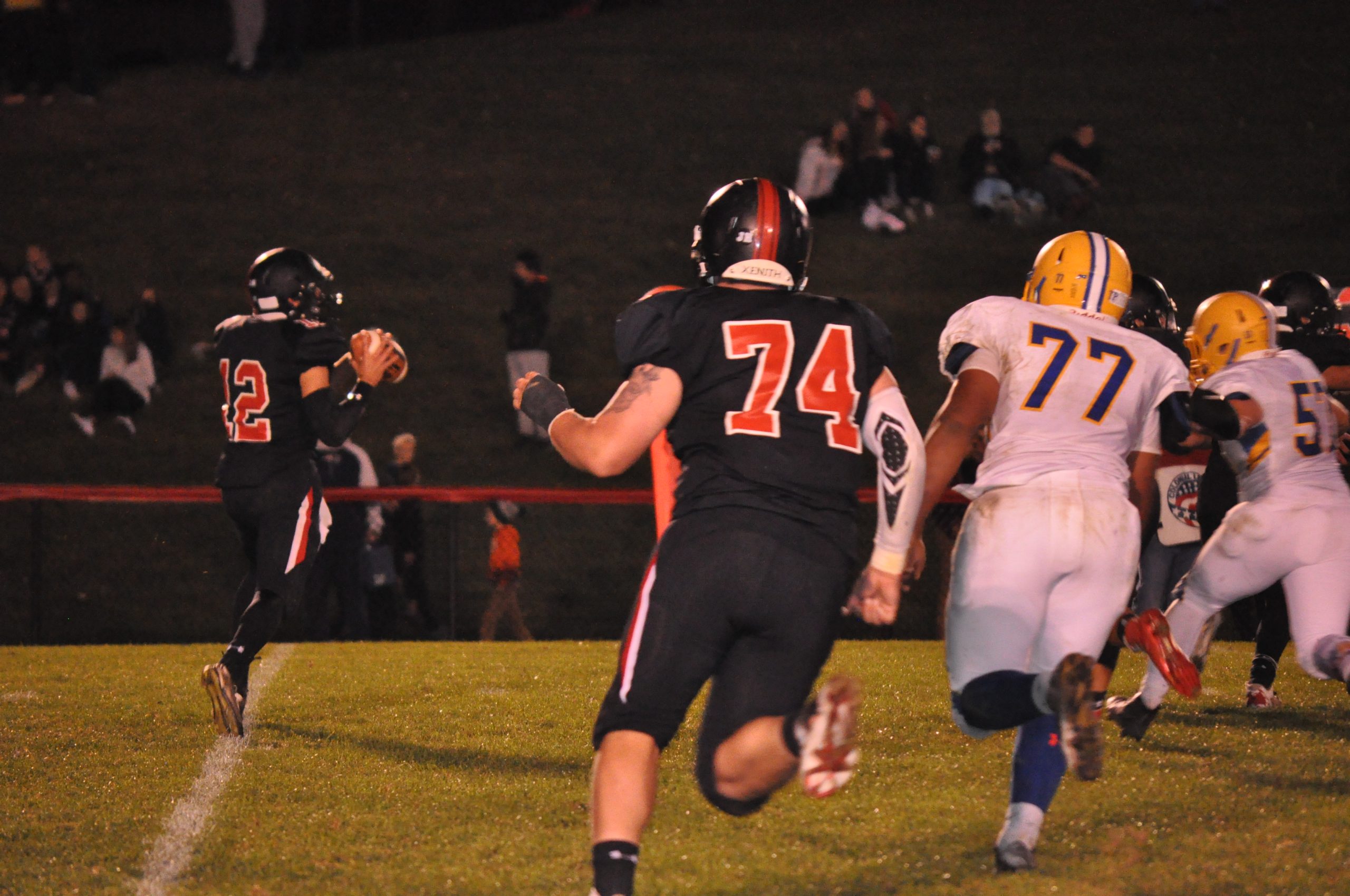 Holub srambles away from the Wilson Warrior defense.