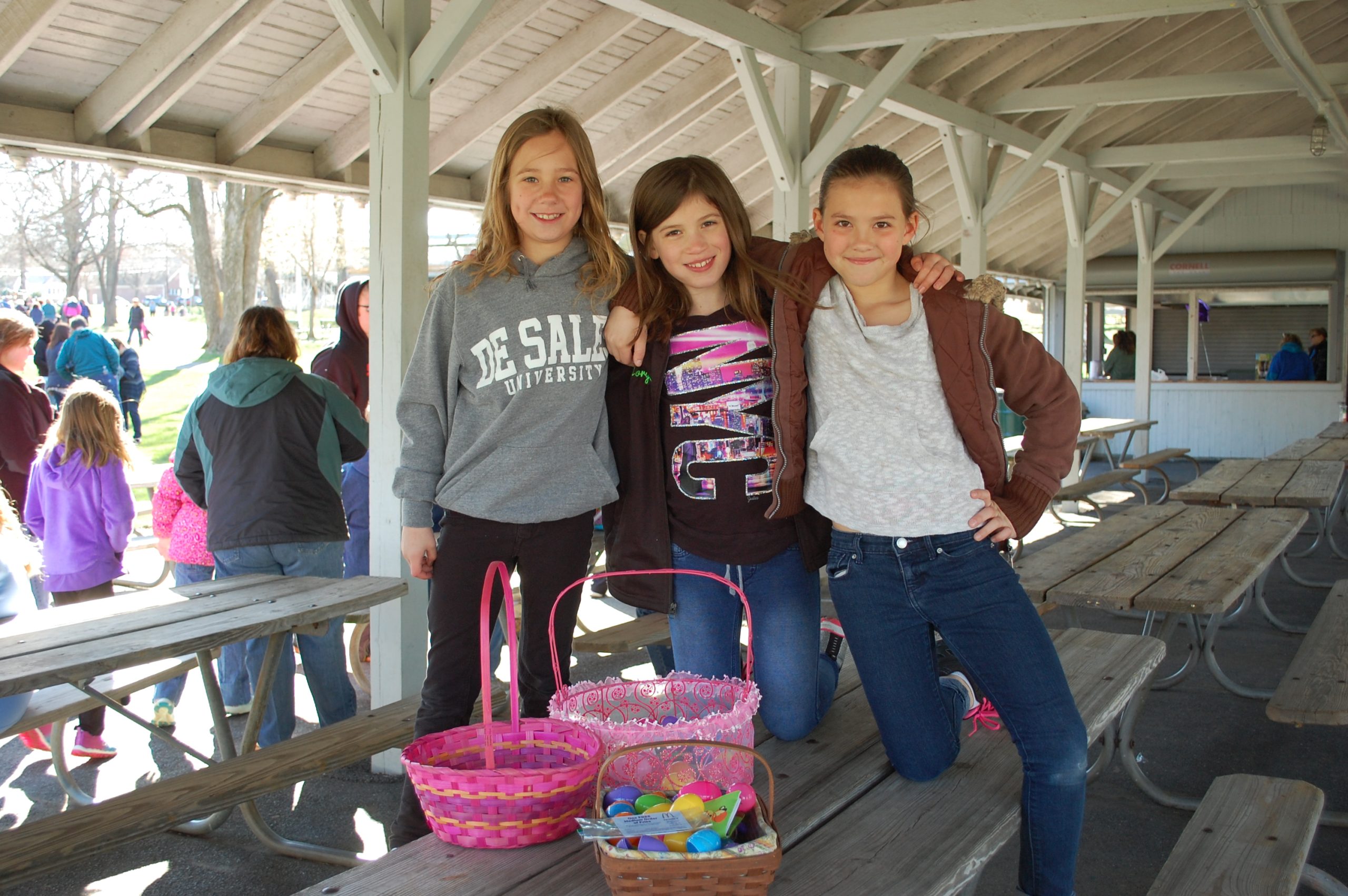 From left, Rhiley Poniktera of Coopersburg, Morgan Krewatch of Hellertown and Karlye Teman of Springtown gather after the egg hunt for a photograph.