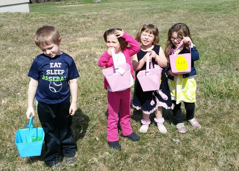 Students hunted for Easter eggs outside the school on a warm March day.