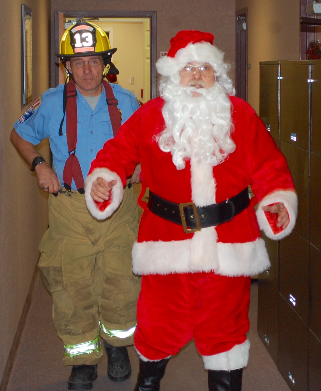 Santa receives a fire company escort to his seat inside Hellertown Borough Hall.