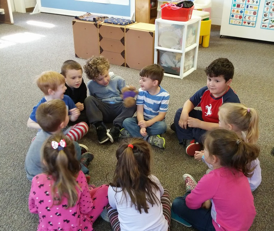 Students play a game of "Hot Potato."