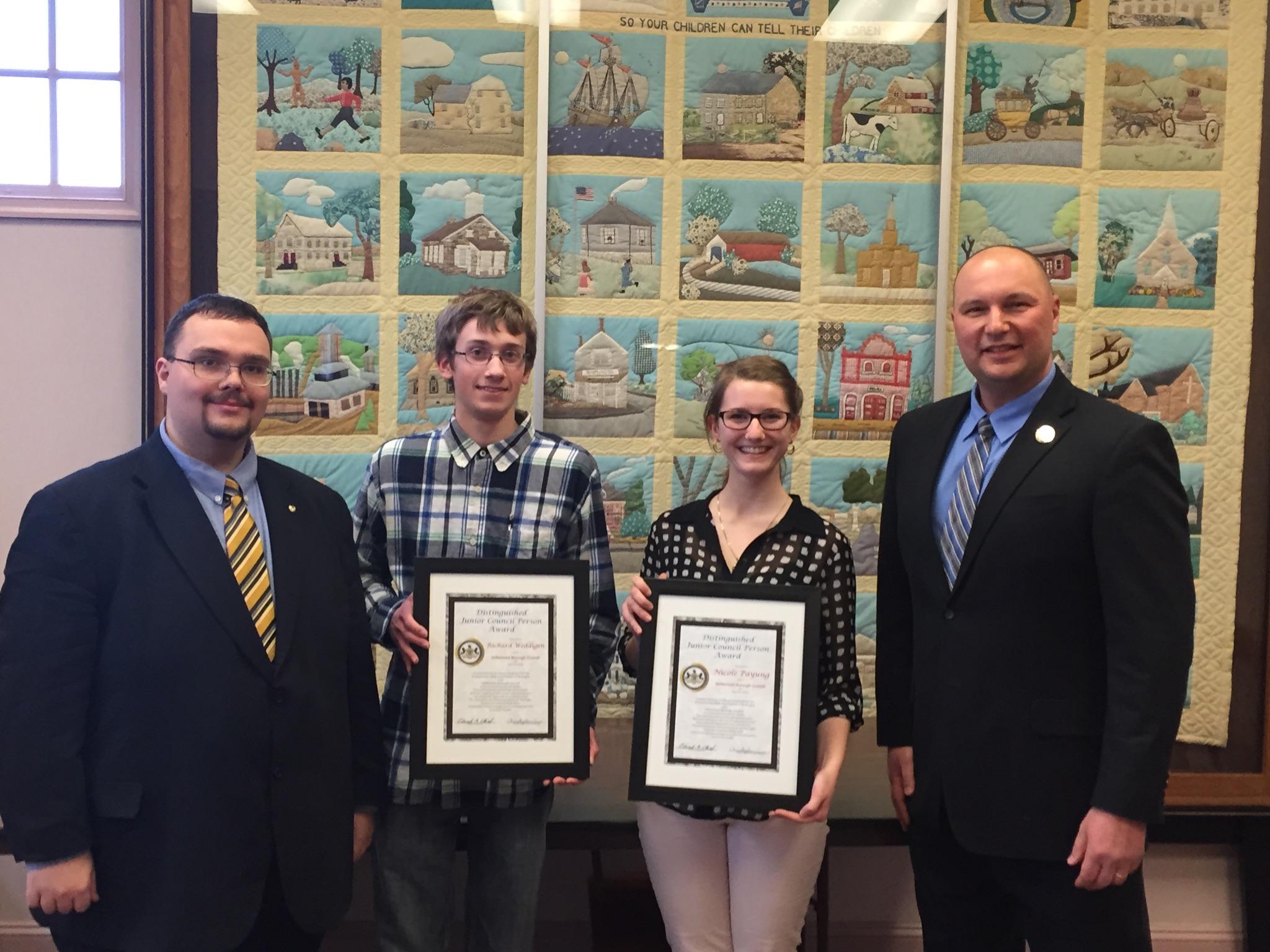 A bouquet placed inside a shoe peeks out from underneath the one-room school's old coal stove