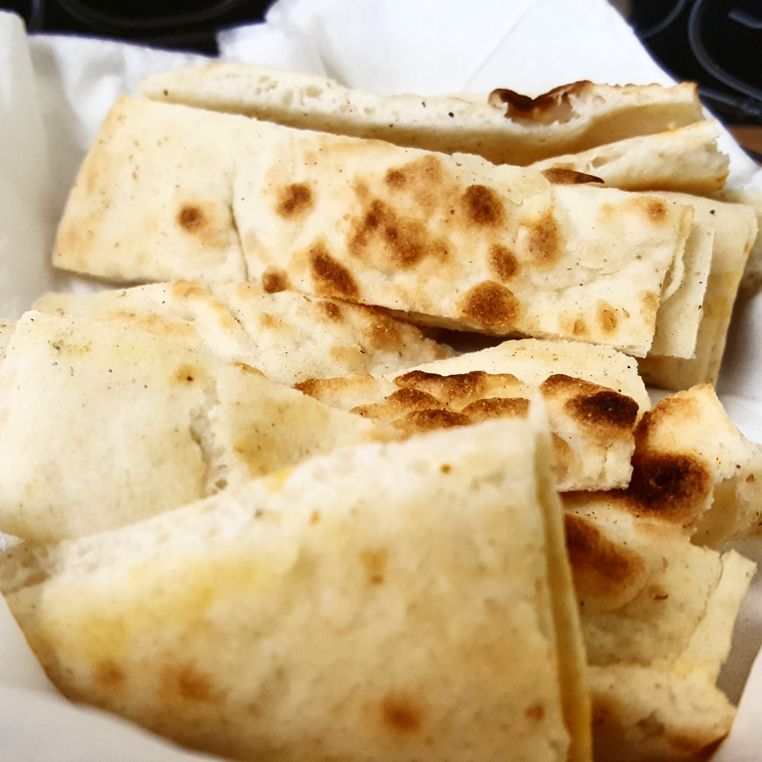 Warm, flavorful pita bread for dipping is served in baskets.