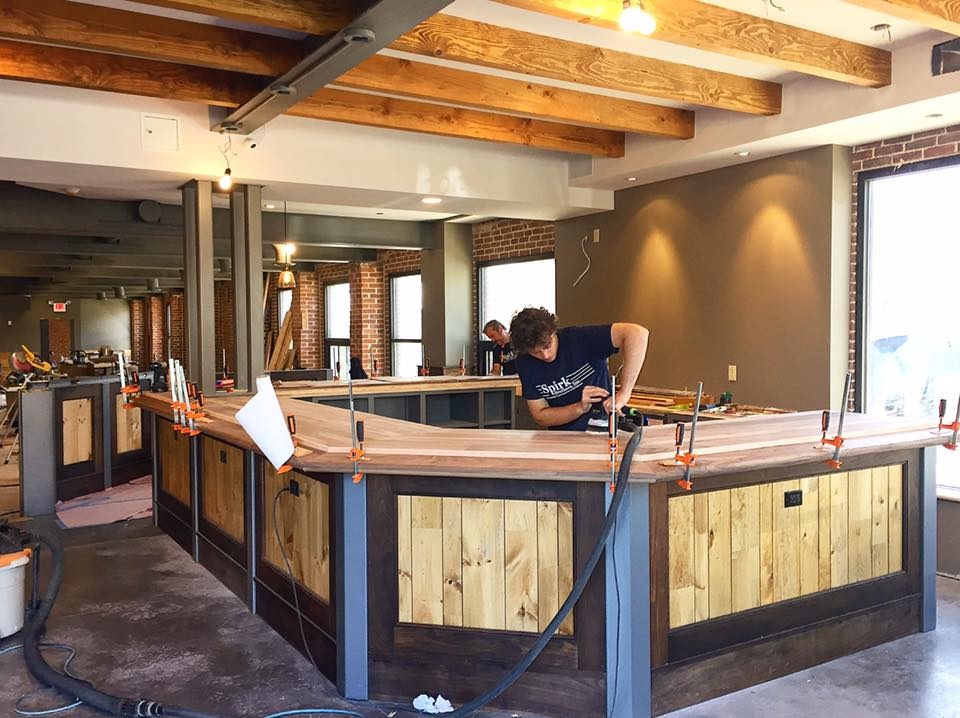 Finishing touches are placed on the bar at Lost Tavern Brewing in early June.