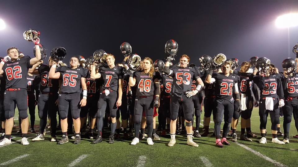 Still Proud: The Panthers hold their helmets up after losing to Imhotep Charter in the PIAA AAA semifinals in Bethlehem Friday.