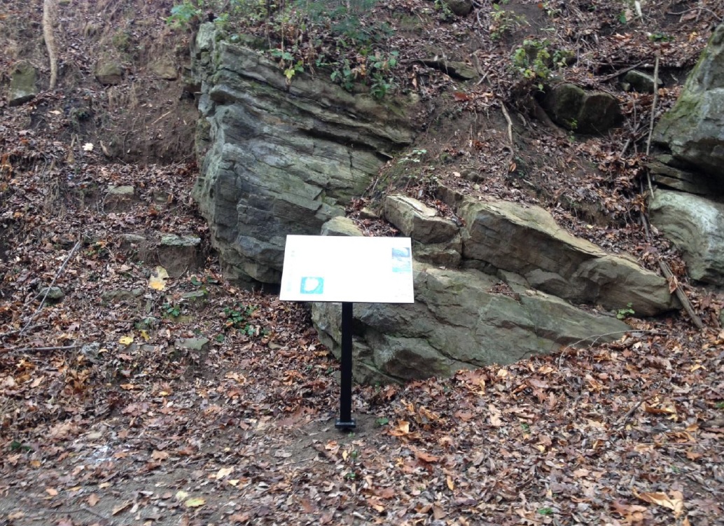 An educational sign has been placed in front of a 500 million year-old rock outcrop along the Saucon Rail Trail in Lower Saucon Township.