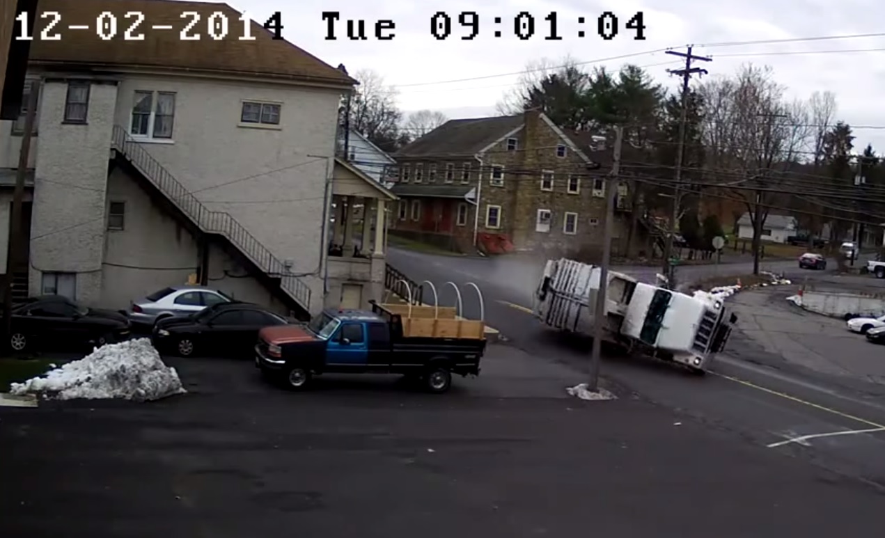 A screen shot from a video of the rollover garbage truck accident that occurred at Flint Hill Road and Rt. 412 in Lower Saucon Township on Dec. 2, 2014.