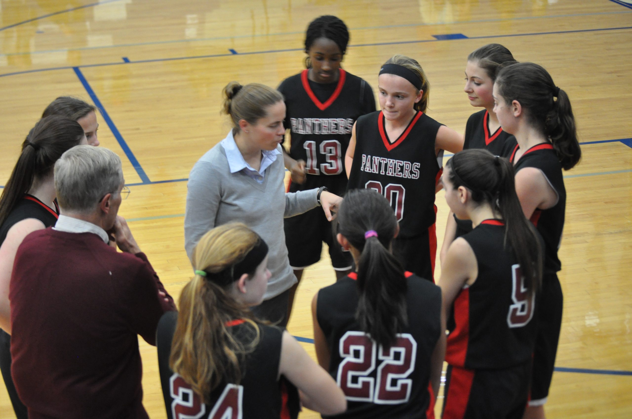 SV Girls Junior High Coach Ochse talks strategy with her team.