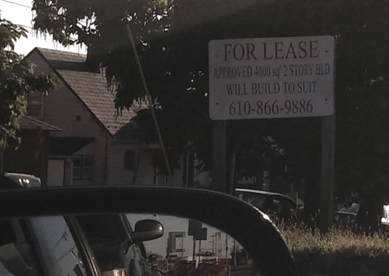 A sign advertising the property for lease is posted on the grassy lot at Kiernan Avenue and Main Street in Hellertown.