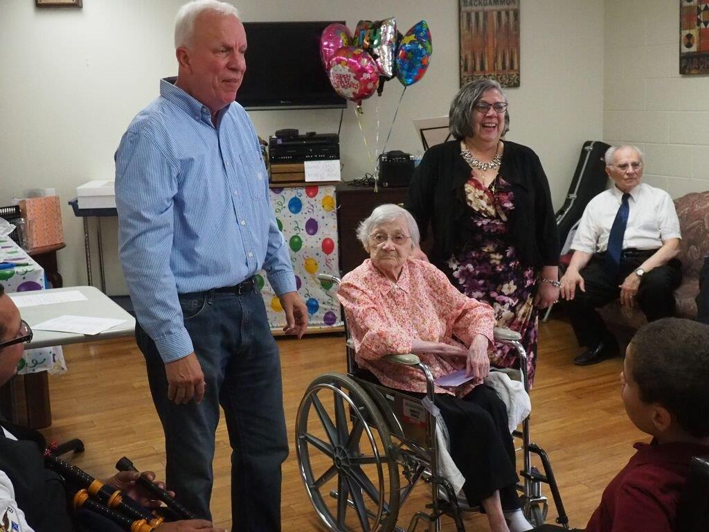 Minnie Poulton is congratulated on her 108th birthday by Lower Saucon Township councilman David Willard and councilwoman Priscilla deLeon.